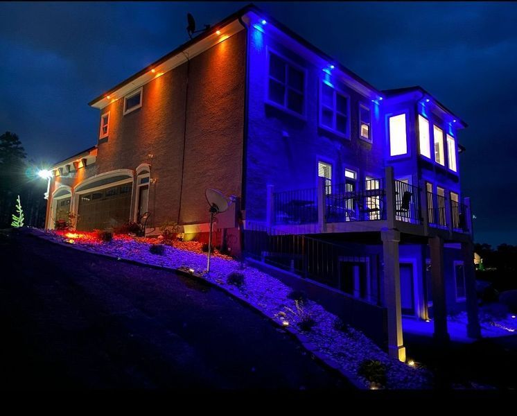 A house is lit up with blue lights at night