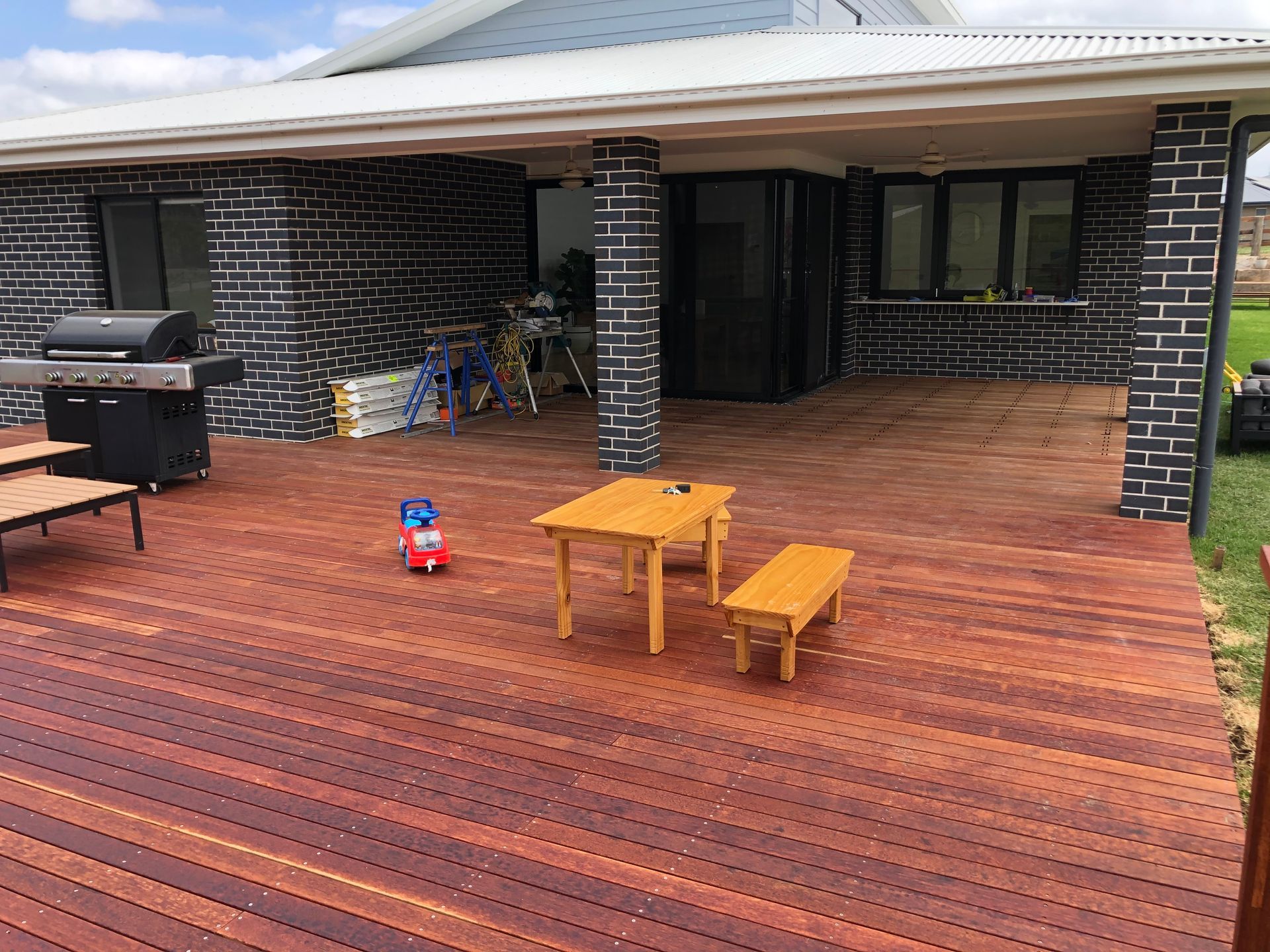 A Drill Is Sitting on Top of A Wooden Deck — Highline Carpentry in Kahibah, NSW