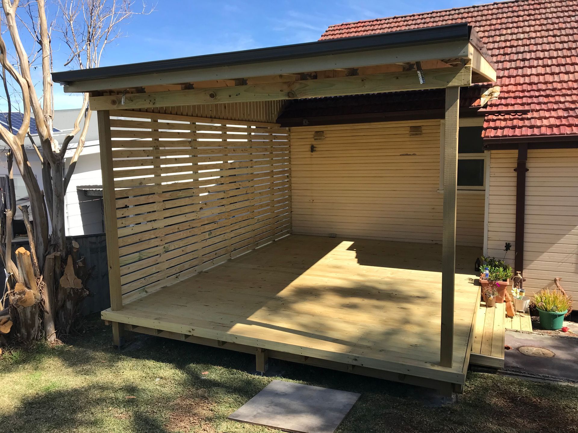 A Carport with A Canopy Over It Is in Front of A House — Highline Carpentry in Kahibah, NSW