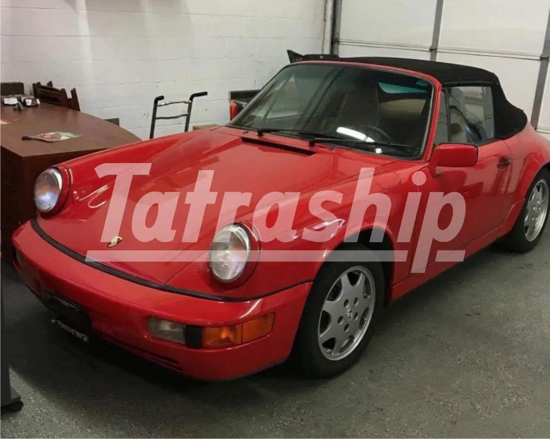 A red car with the word tatraship on the side