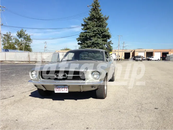 A ford mustang is parked in a parking lot