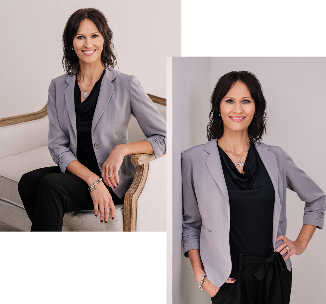 A woman is sitting on a couch and standing next to a wall.