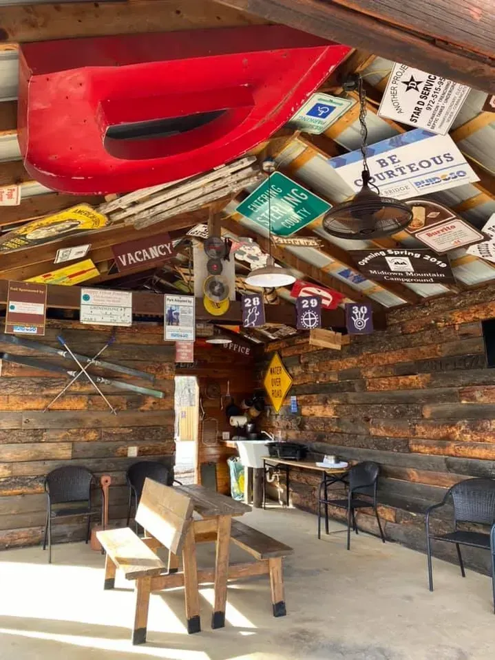 A room with a lot of signs hanging from the ceiling.