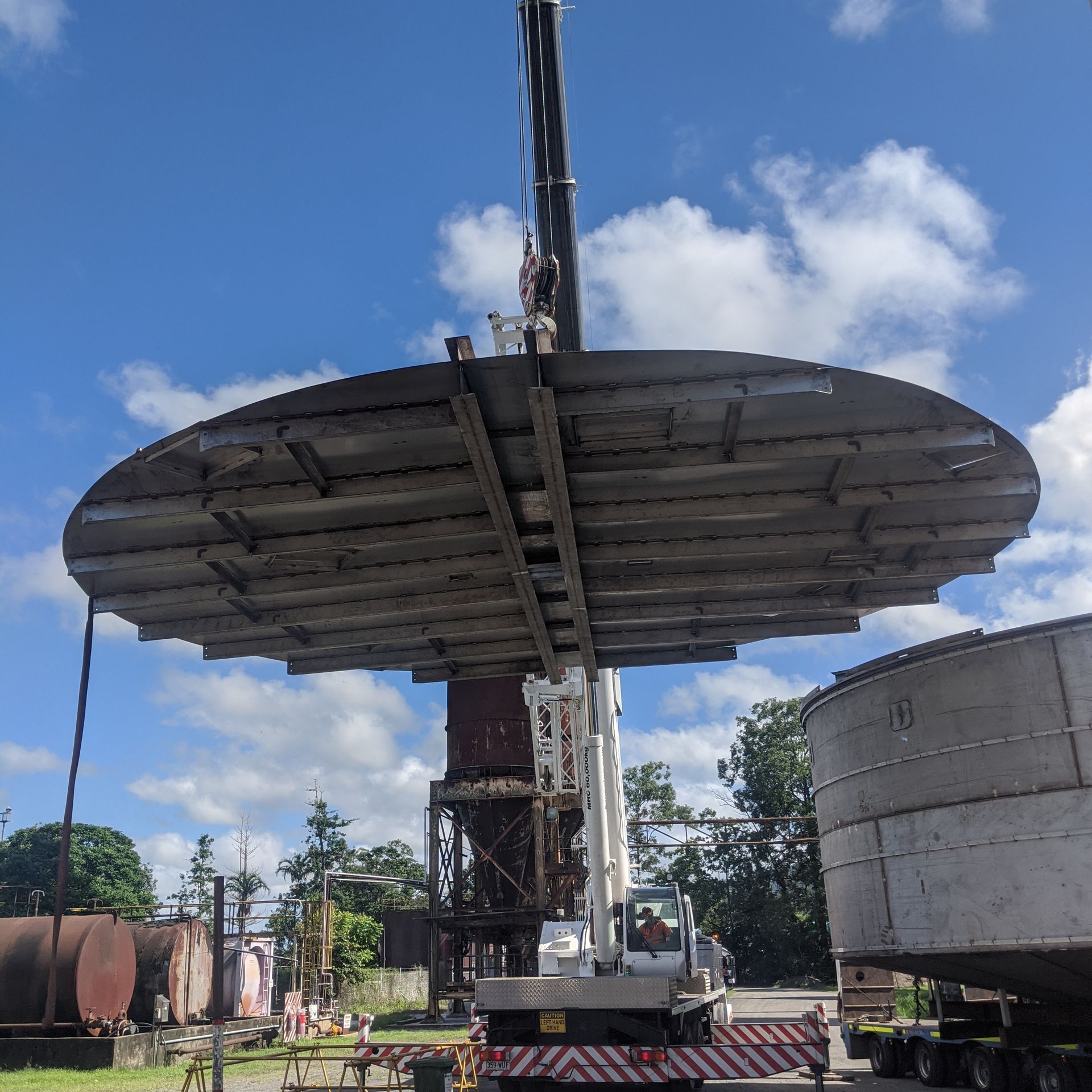 A Tank Lid On A Crane — Origin Group in Paget, QLD