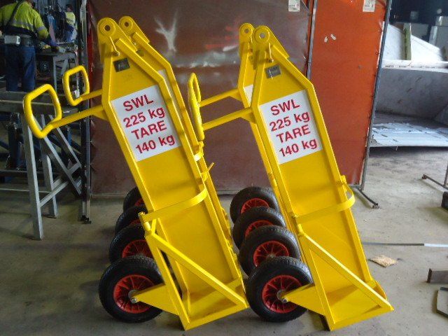 Two Yellow Carts That Say Swl 225 Kg Tare 140 Kg — Origin Group in Paget, QLD