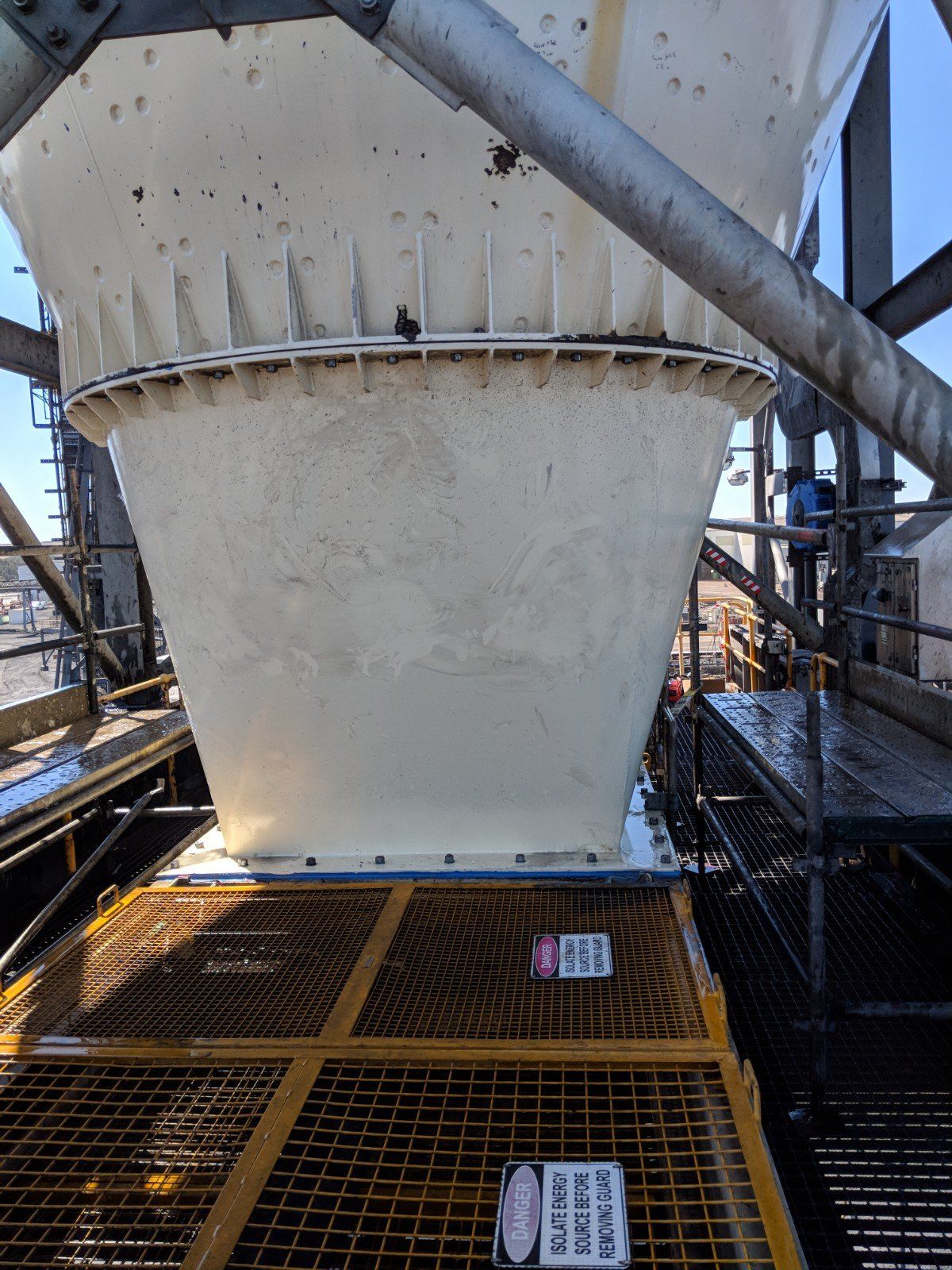 A Large White Container Is Sitting On Top Of A Metal Grate — Origin Group in Paget, QLD