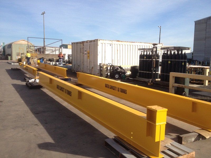 A Row Of Yellow Barriers With The Word Safety On Them — Origin Group in Paget, QLD