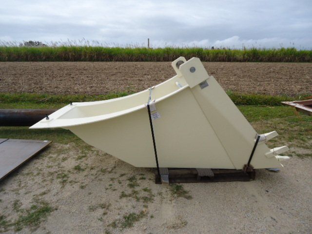 A White Bucket Is Sitting On The Ground In Front Of A Field — Origin Group in Paget, QLD