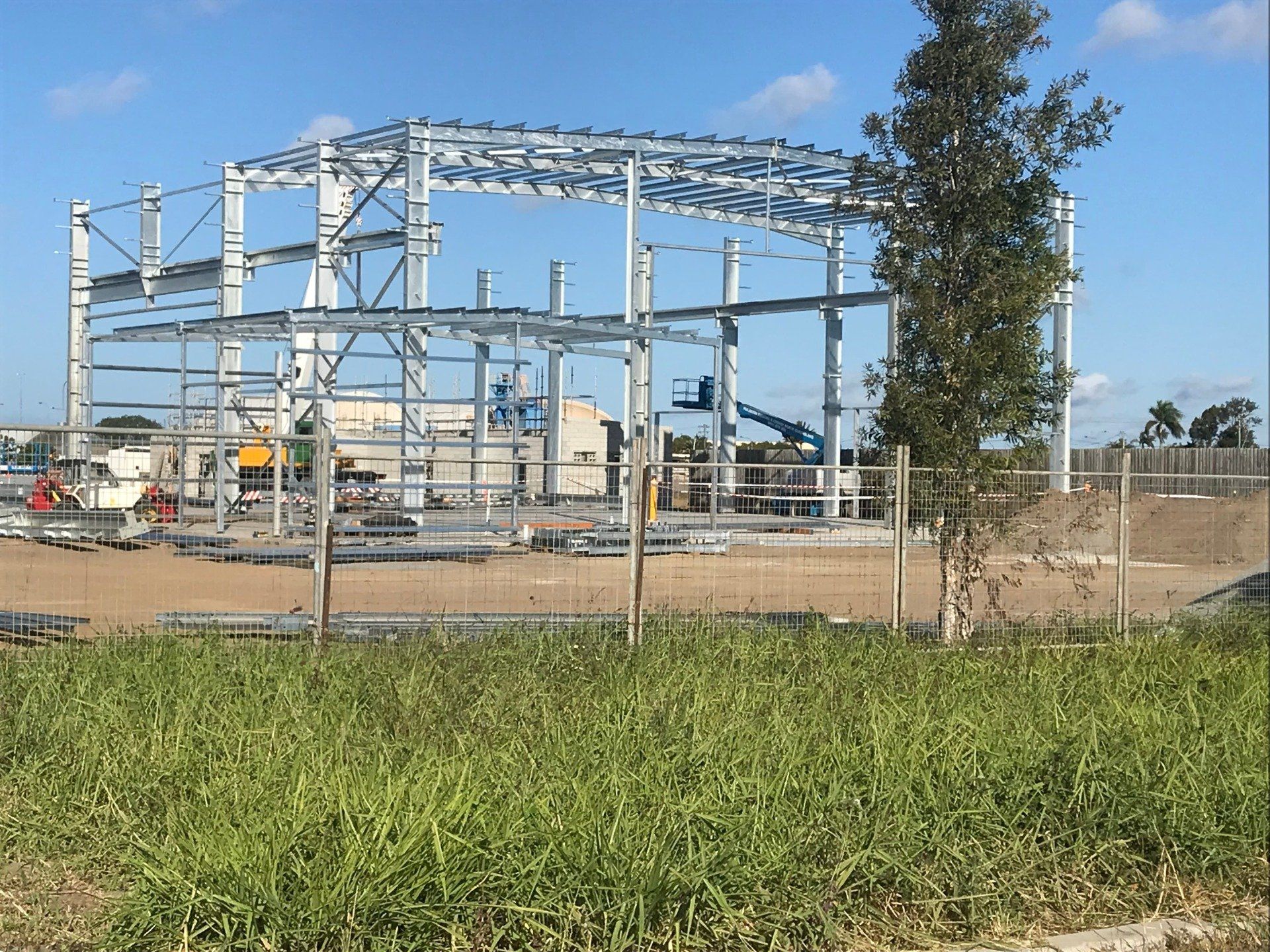 A Large Metal Structure Is Being Built In A Field — Origin Group in Paget, QLD