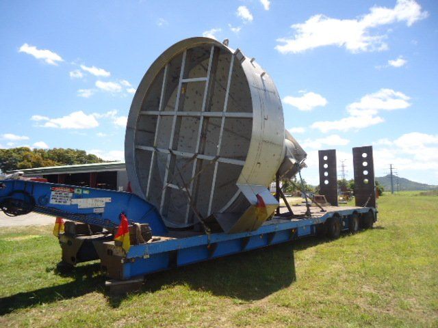 A Blue Trailer With A Large White Object On It — Origin Group in Paget, QLD