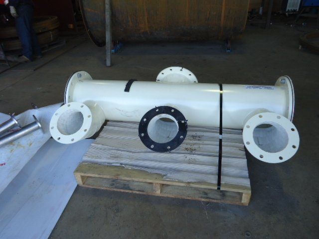 A White Pipe Is Sitting On Top Of A Wooden Pallet — Origin Group in Paget, QLD