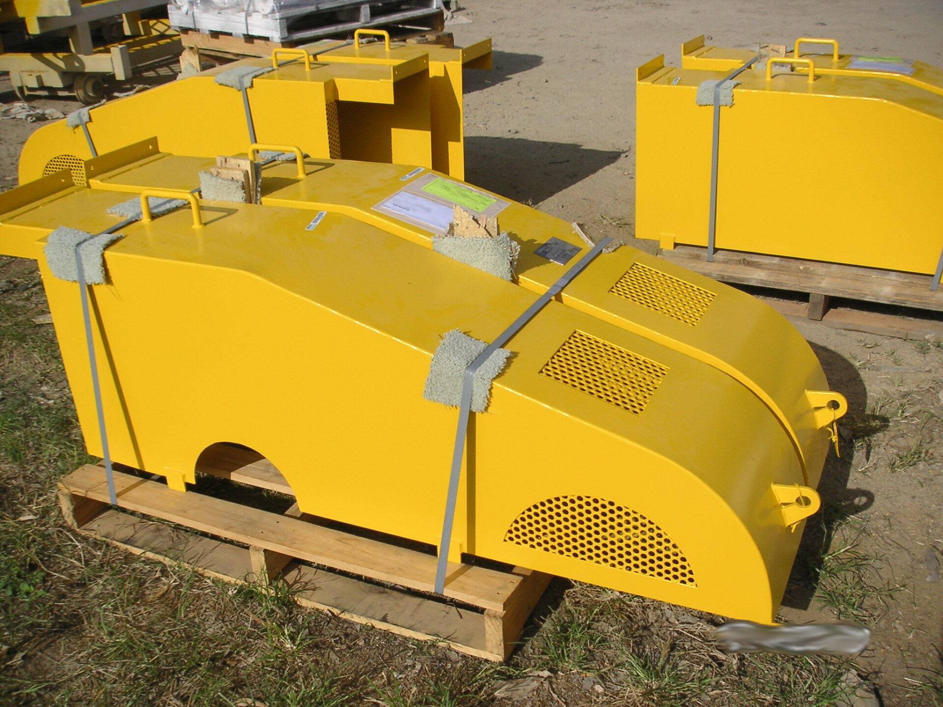 A Bunch Of Yellow Boxes Are Sitting On A Wooden Pallet — Origin Group in Paget, QLD
