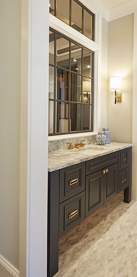 A bathroom with two sinks and a large window.