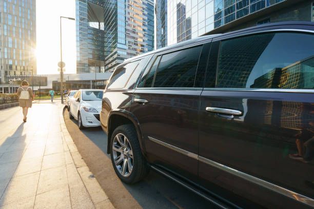 A woman walks beside a car, promoting the 5-Star Limo Rental service on a city street.