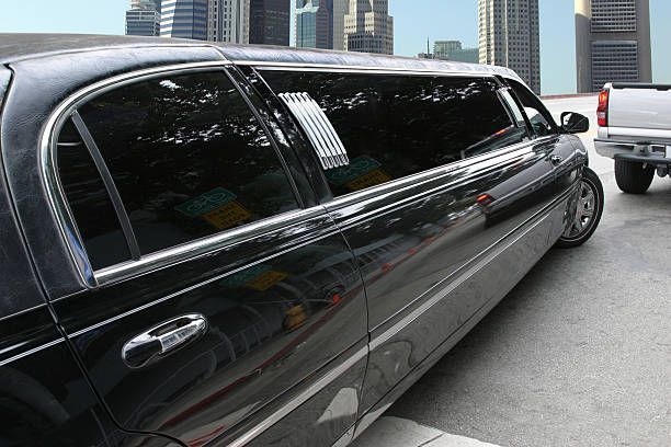 A sleek black limousine parked, showcasing its elegant design for a limo rental service.