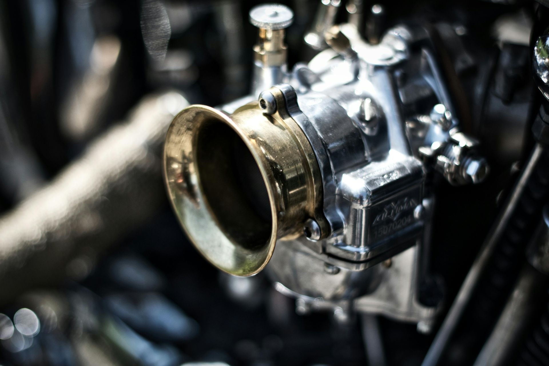 A close up of a carburetor on a motorcycle