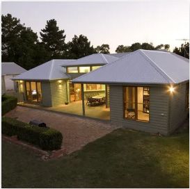 A house with a white roof | Building Services | Coastyle