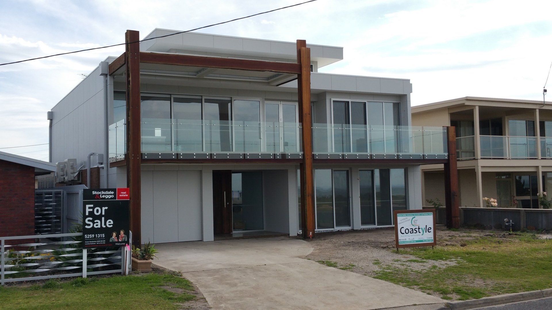 Outdoor House with Umbrella and Sofa Set with Glass Partition | Indented Head, Vic | Coastyle Building Solutions