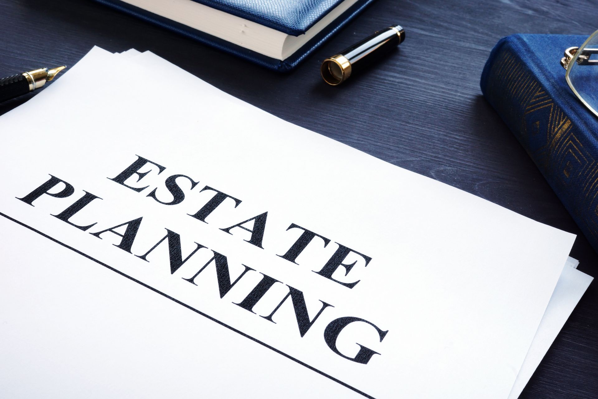 A piece of paper that says estate planning on it