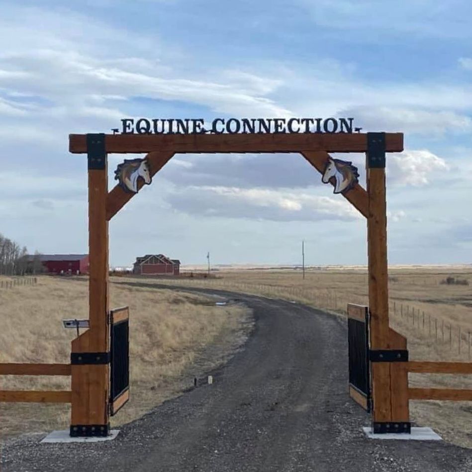 a wooden gate with a sign that says equine connection