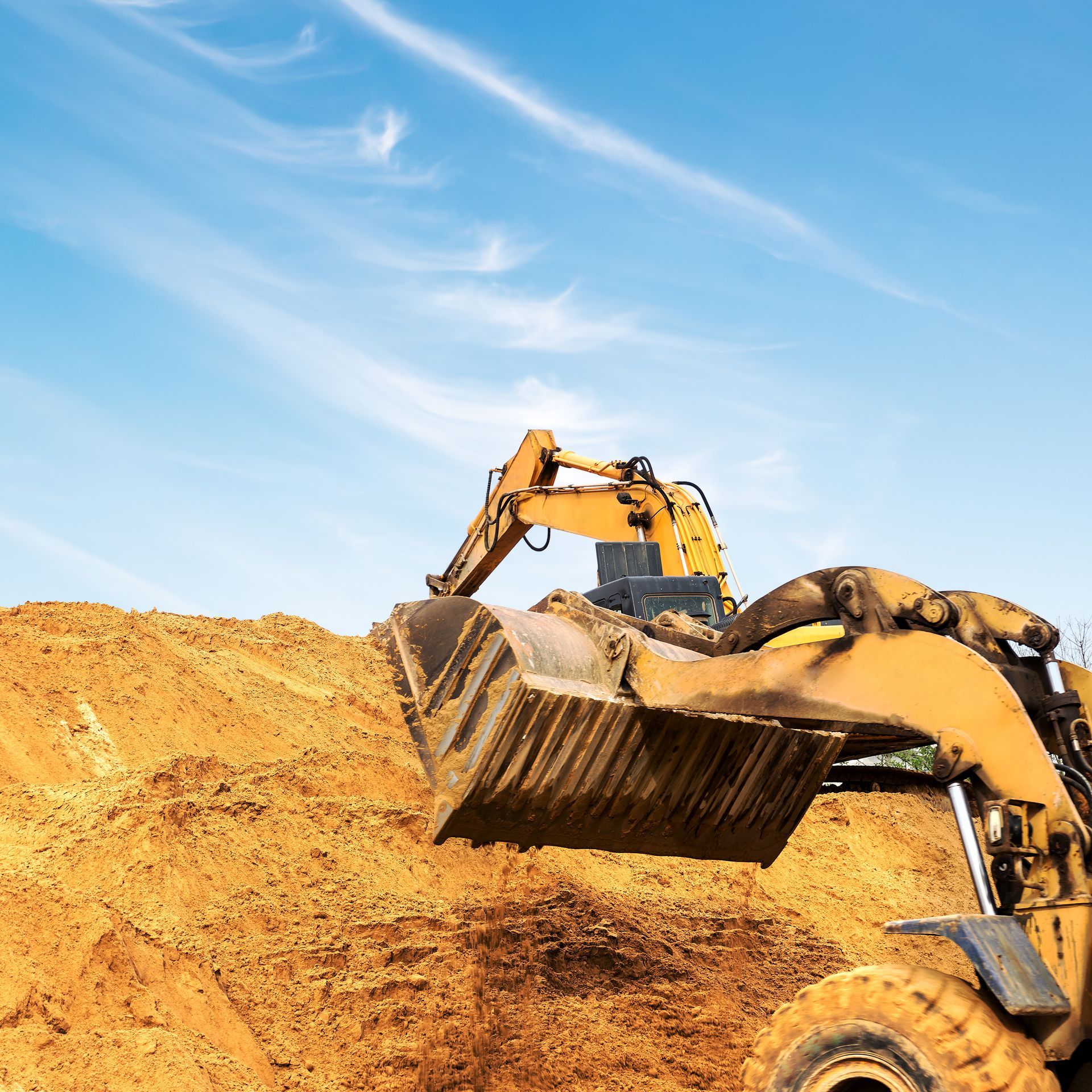 A bulldozer is moving dirt on a construction site.