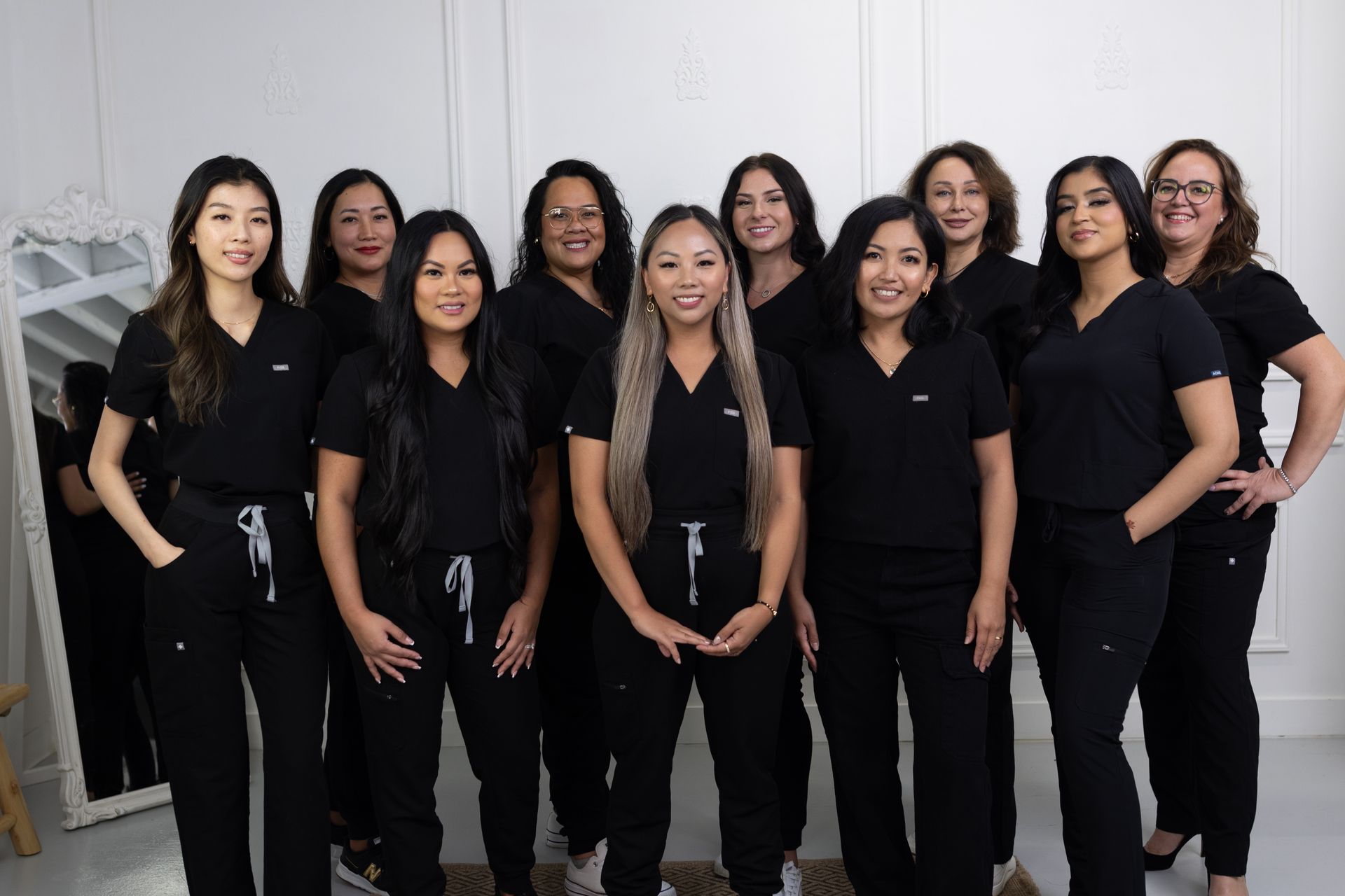 group of happy diverse estheticians at The Narra Clinic