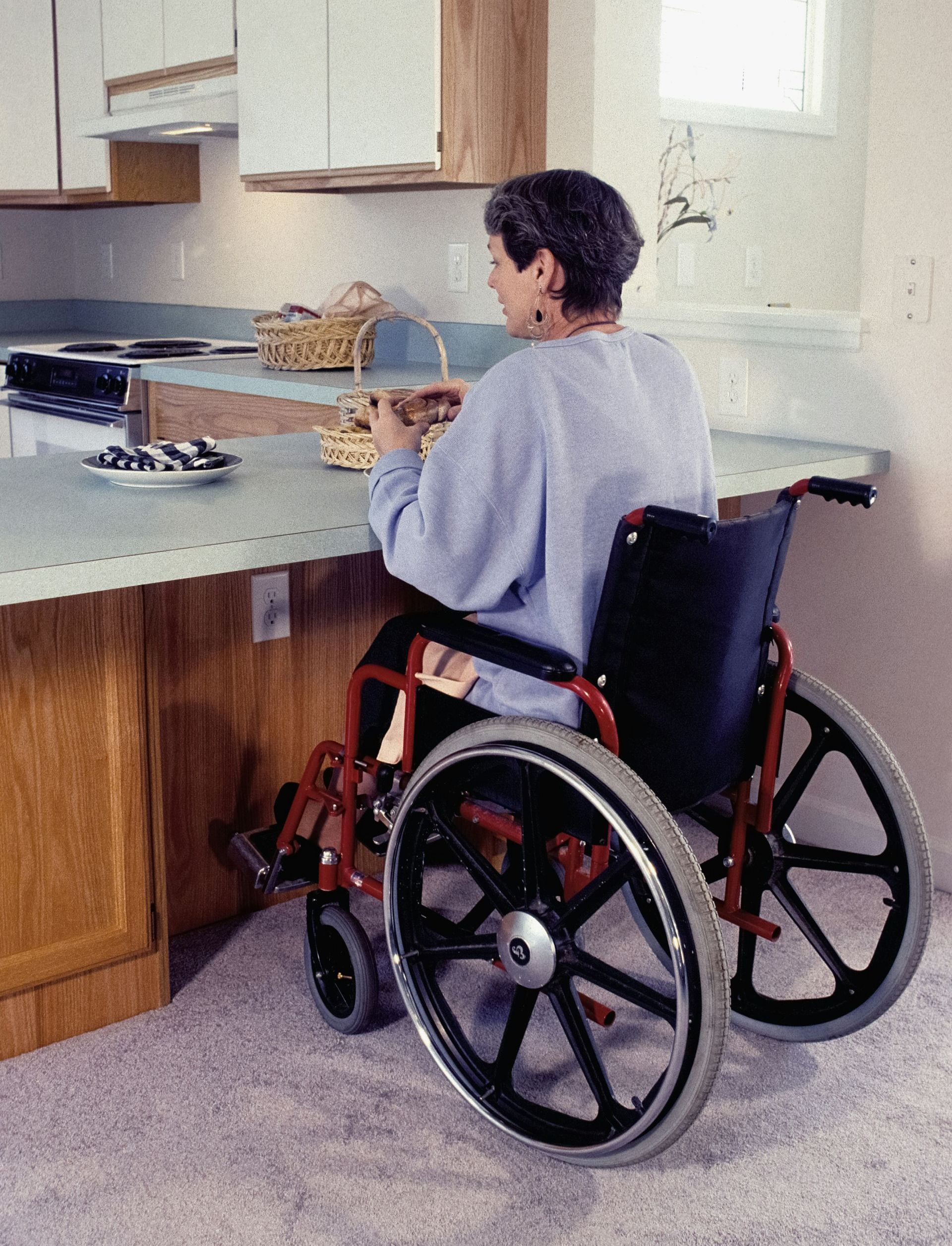 woman in a wheelchair at home