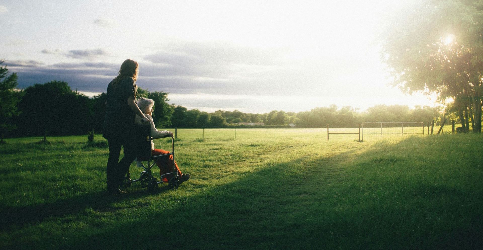 caregiver pushing wheelchair