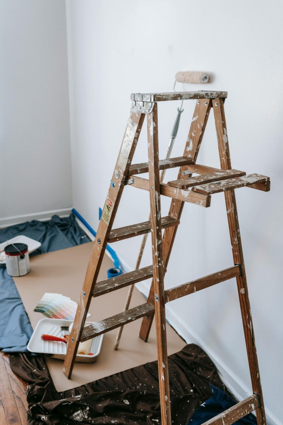Wooden Ladder With Paint Roller For Renovation — Lakecrest Projects in Belmont North, NSW