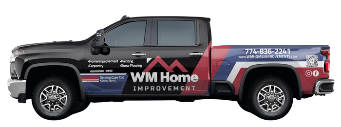 a pickup truck with a wm home advertisement on the side .