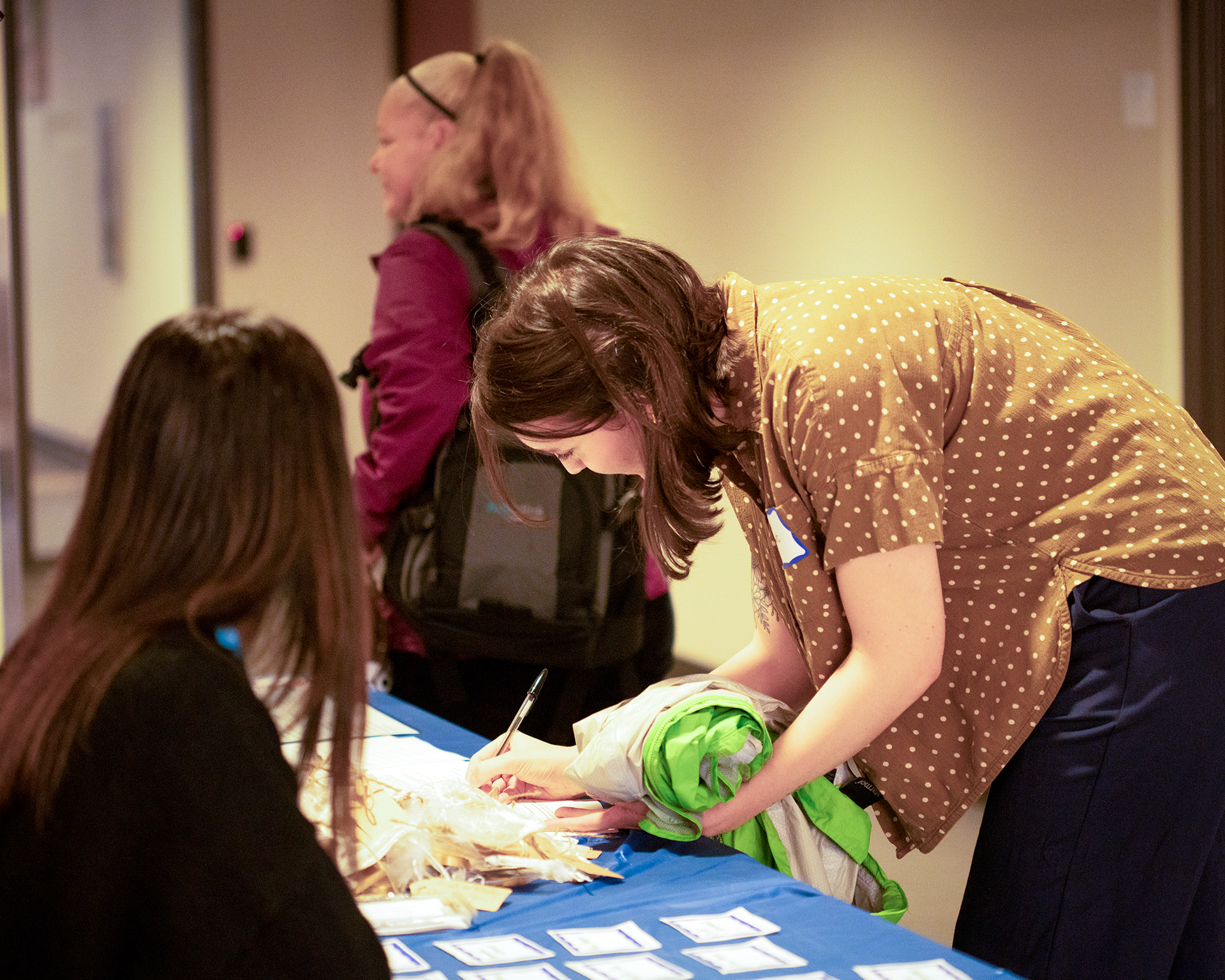 People check-in at the table