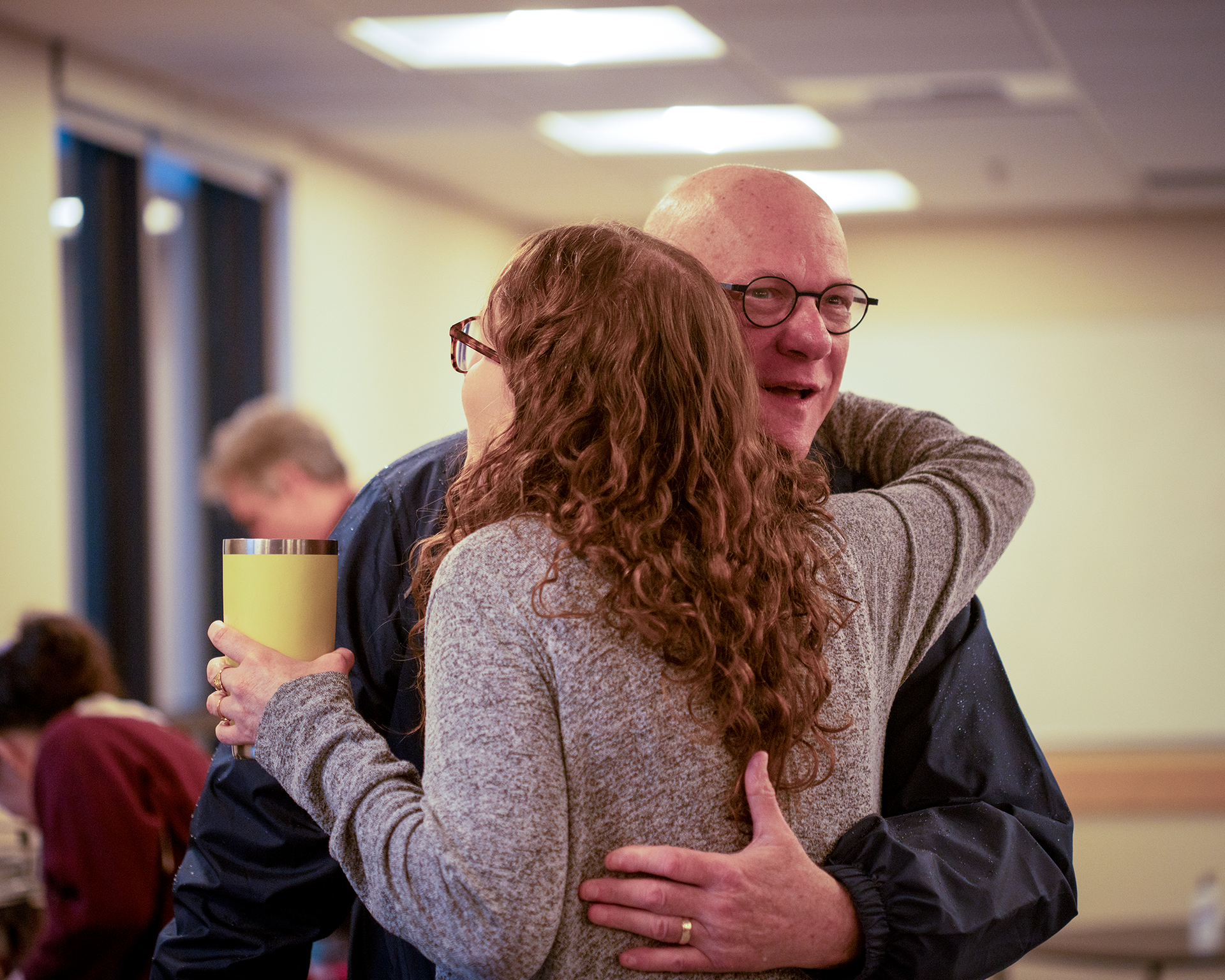 Two people hug at the event