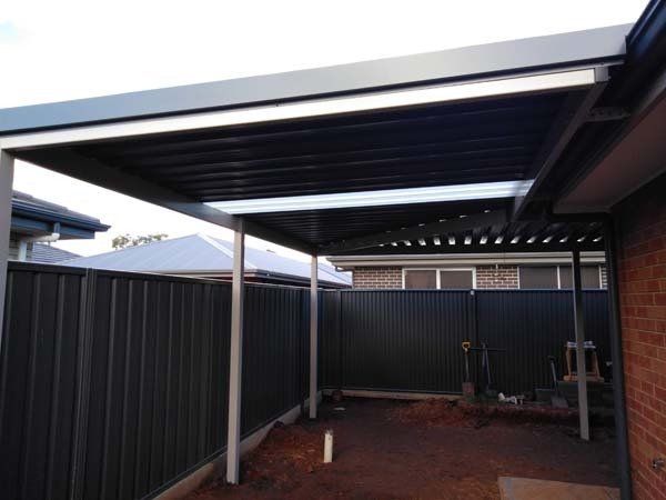 carport ceiling with custom steel fencing