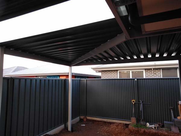 carport ceiling with custom fencing