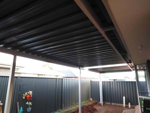 carport ceiling with custom black fencing