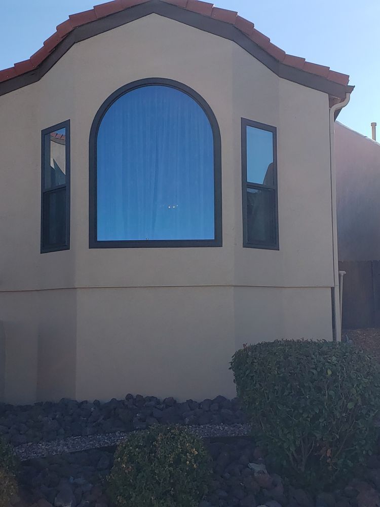 A house with a large window on the side of it