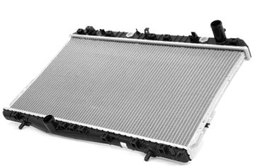 A radiator is sitting on top of a white surface. Cooling system diagnostics and repair