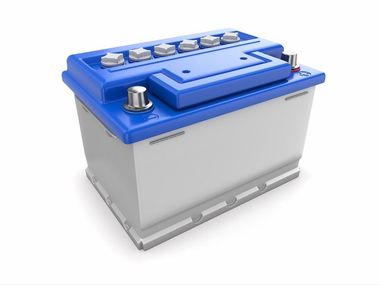 A blue and white car battery on a white background. electrical system diagnostics and repairs.