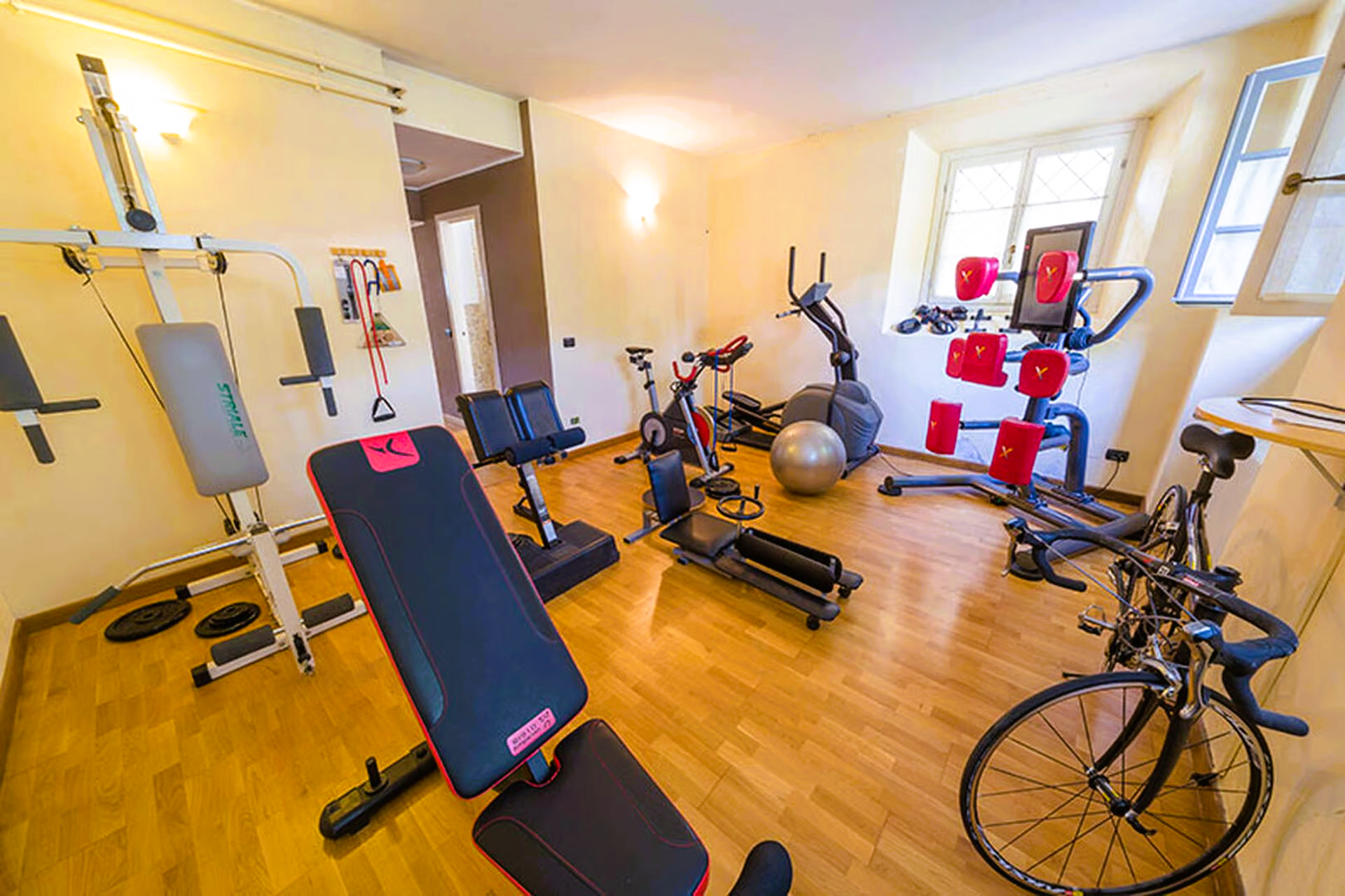 There is a bicycle in the middle of the room.