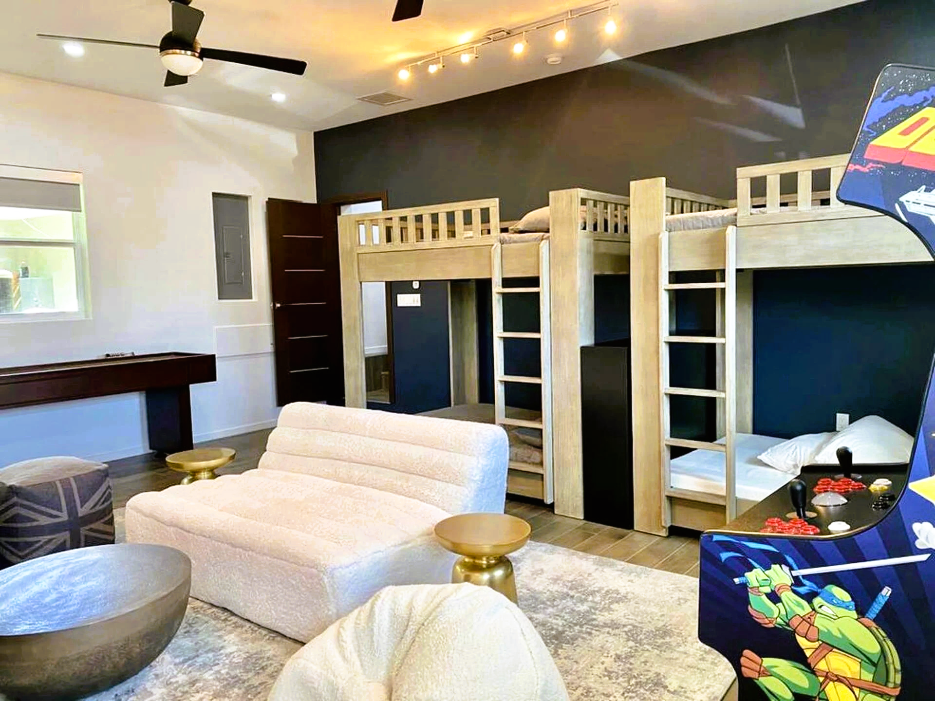A living room with bunk beds and a couch.