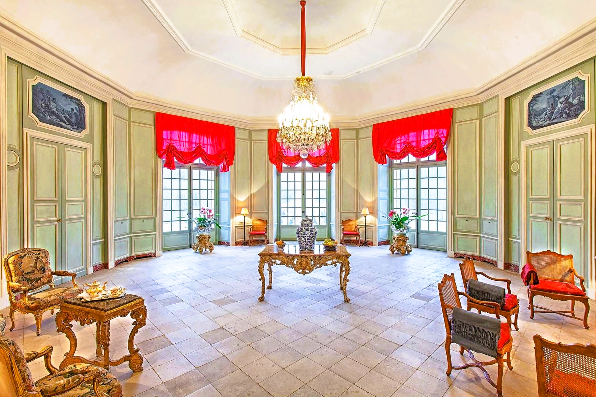 A large room with a lot of furniture and a chandelier.