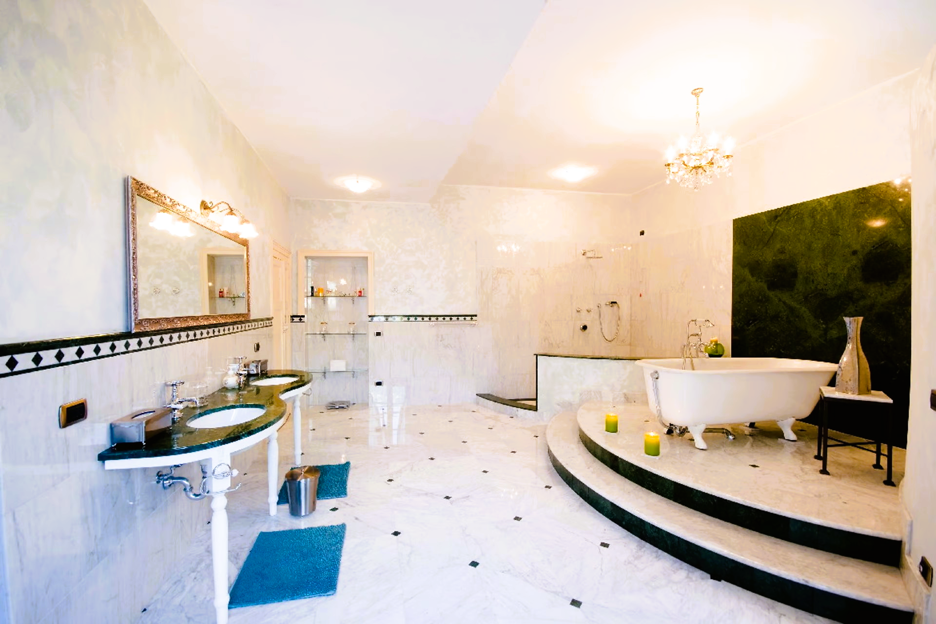 A bathroom with two sinks and a bathtub