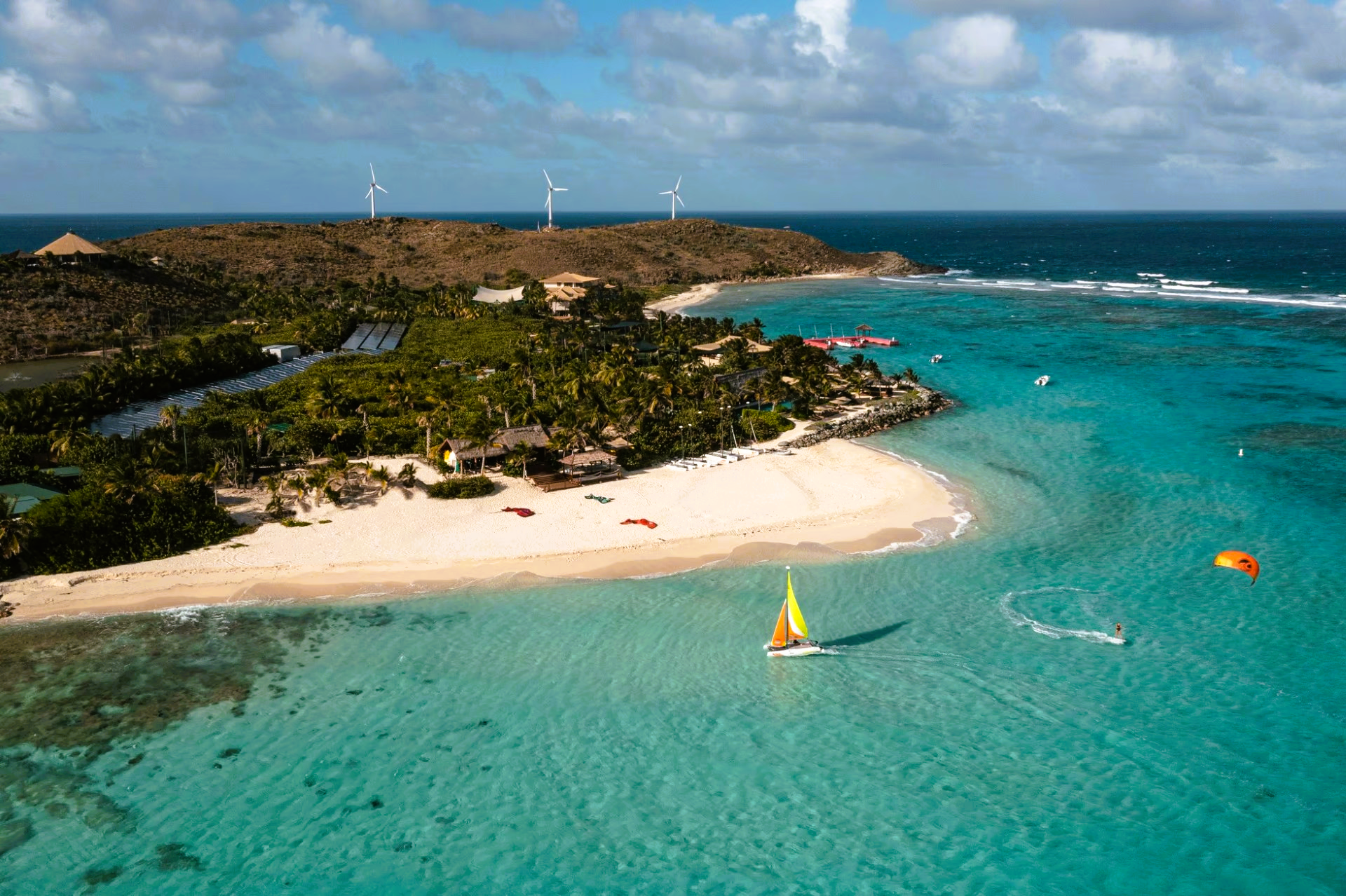 An aerial view of a small island in the middle of the ocean.