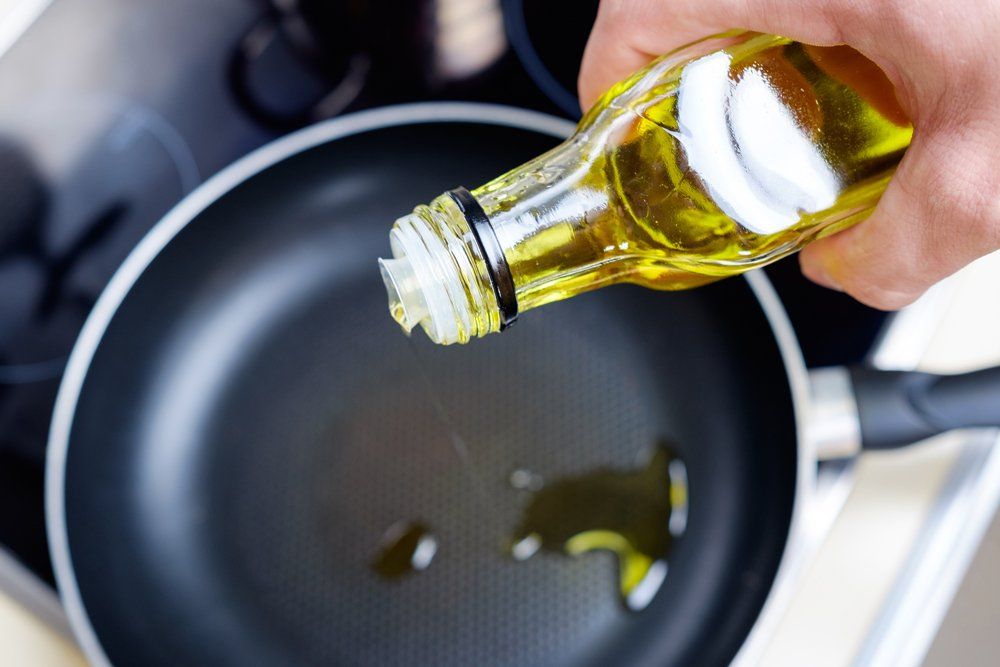 Pouring Olive Oil On Frying Pan — South Haven, MI — Olive Cart