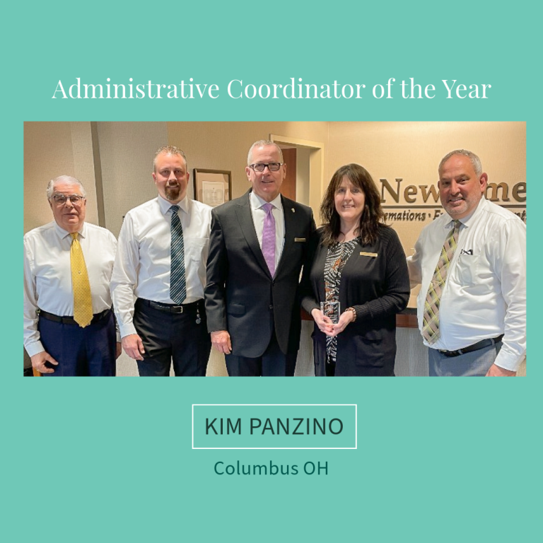 Group of five people; Kim Panzino, Administrative Coordinator of the Year, Columbus OH. Formal office setting.