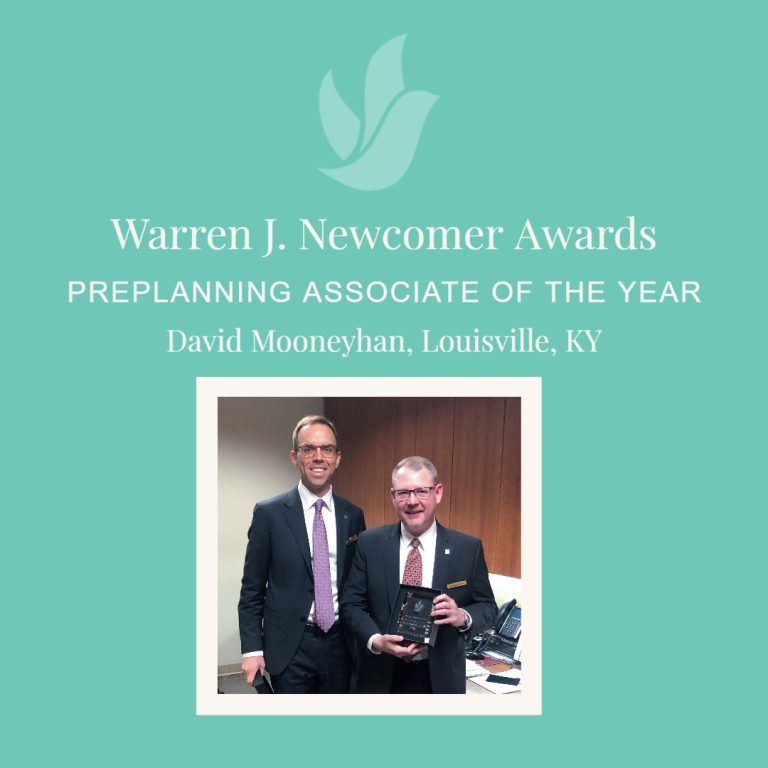 Announcement of Warren J. Newcomer Awards. David Mooneyhan of Louisville, KY is Preplanning Associate of the Year; two men in suits pose.
