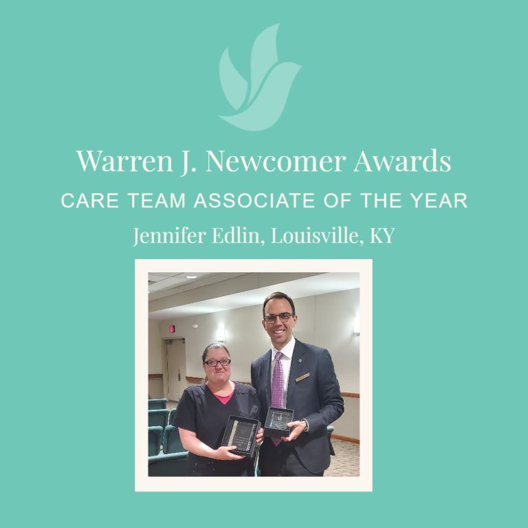 Jennifer Edlin, Louisville, KY, Care Team Associate of the Year, poses with an award, and a man in a suit.