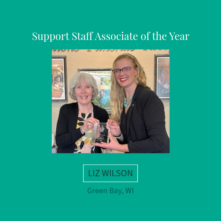 Two women holding an award. Text reads