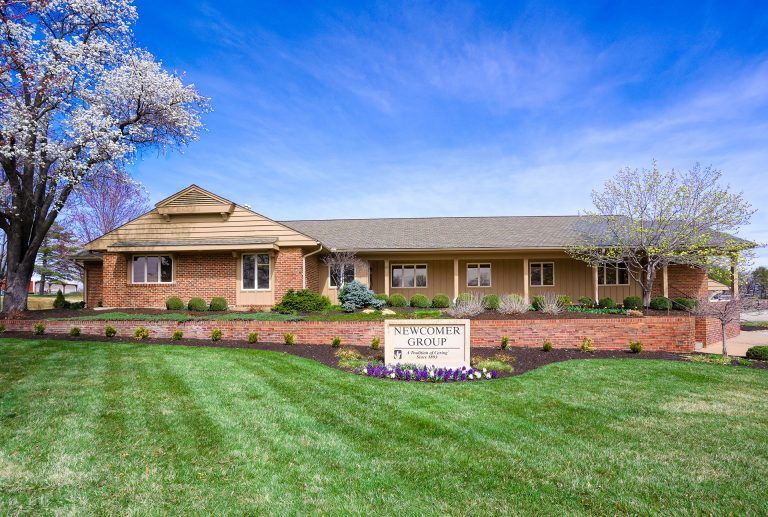 A brick building with a sign that says 