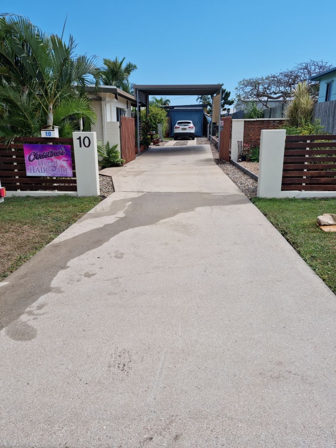 A Man is Cleaning a Roof With a Brush — Blast H2O In Collinsville, QLD